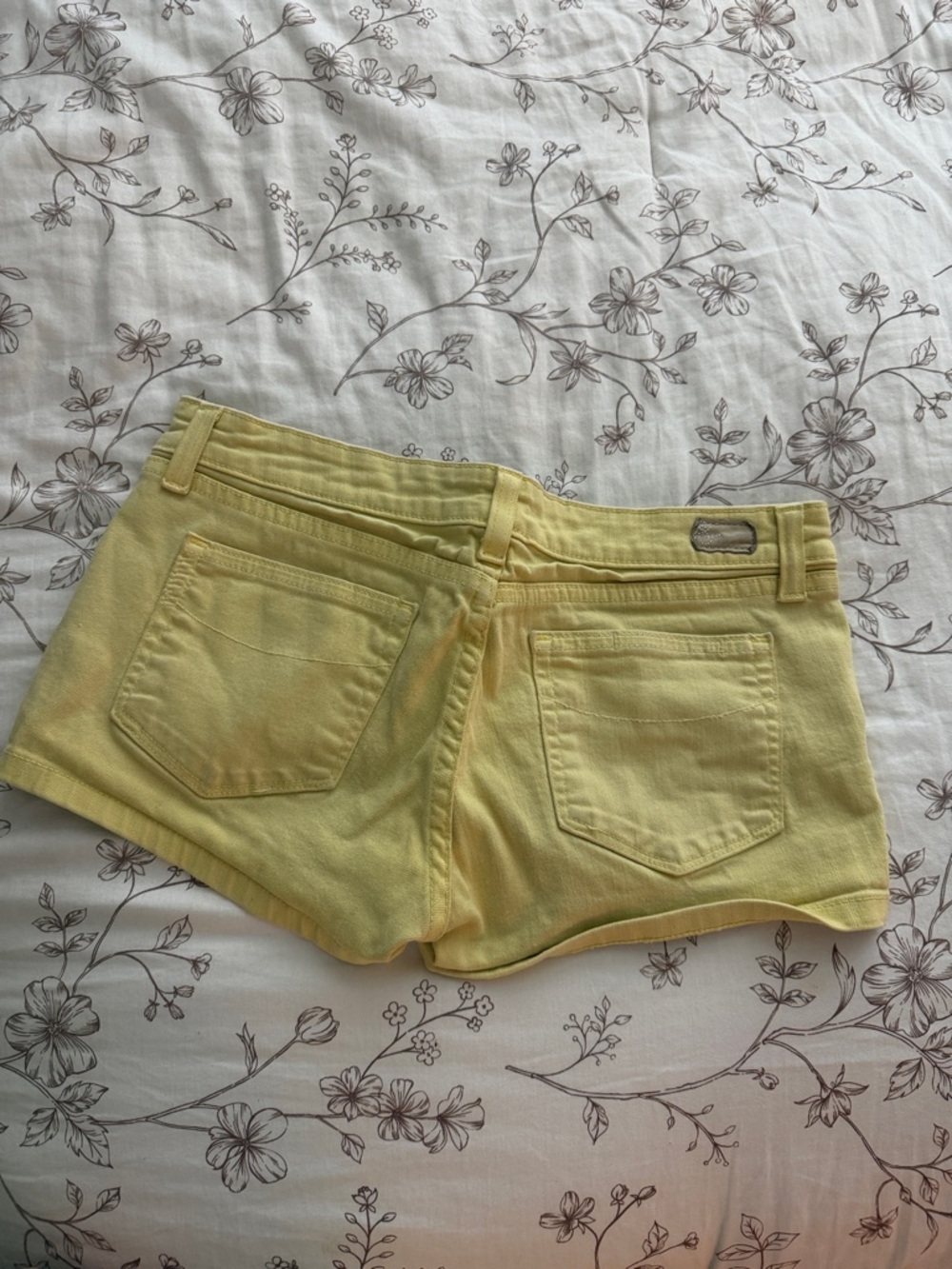 PAIGE Soft Yellow Denim Cutoff Shorts